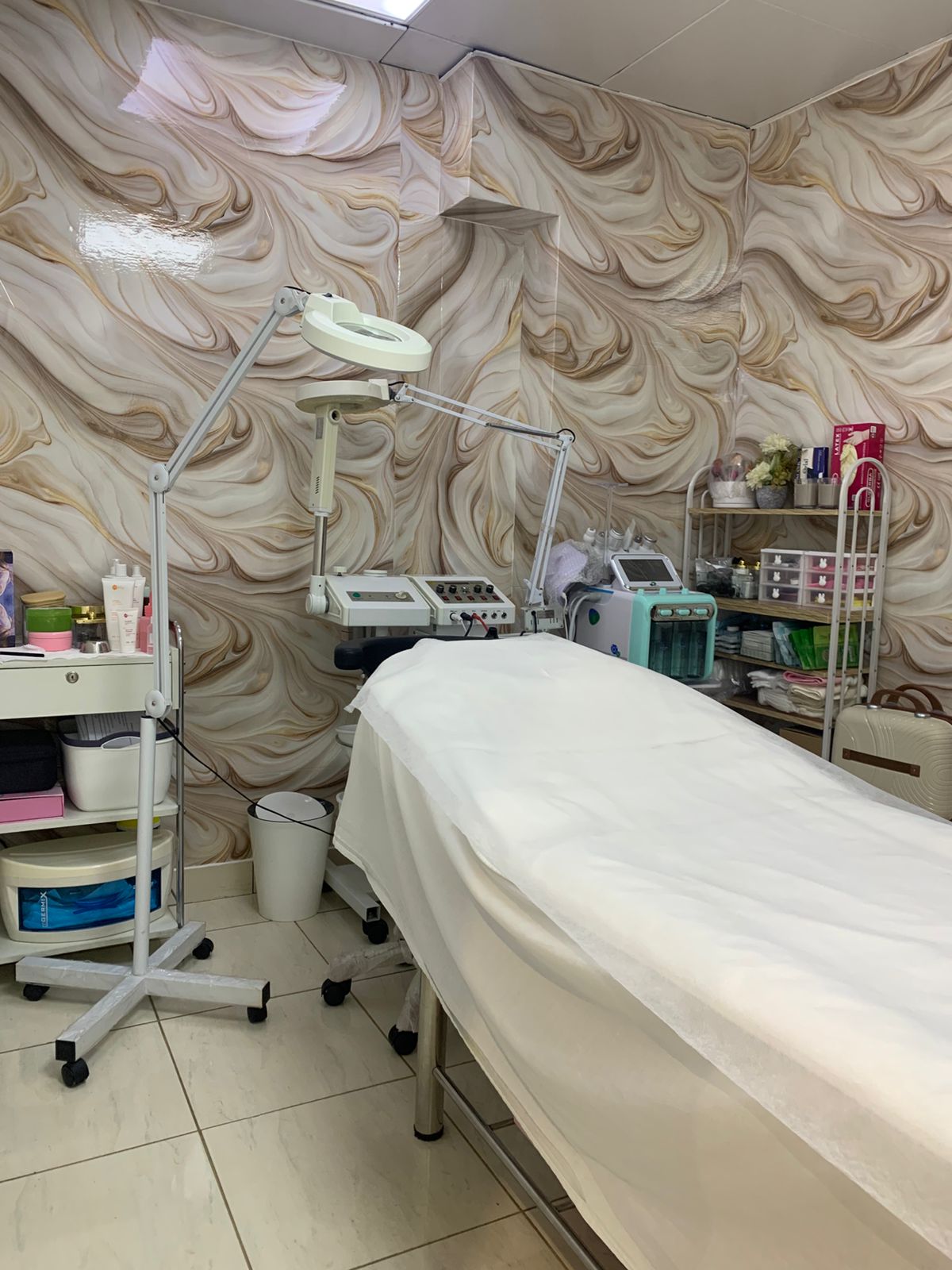 Private facial treatment room with professional beauty equipment